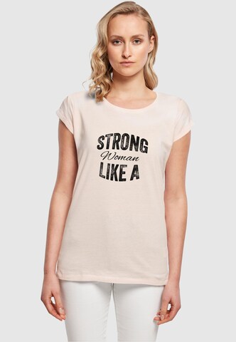 Merchcode T-Shirt 'WD - Strong Like A Woman' in Beige: predná strana