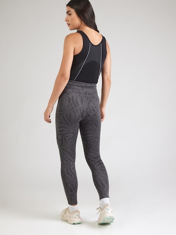 PUMA Skinny Urheiluhousut 'ESSENTIAL' värissä harmaa
