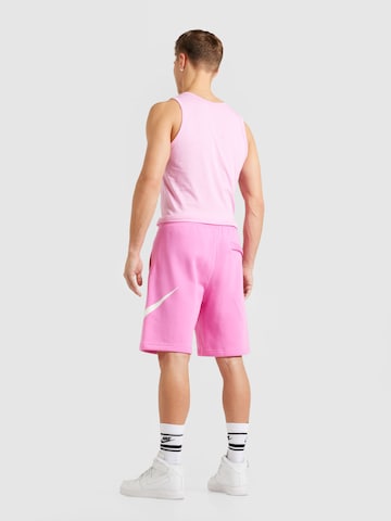 Nike Sportswear Normalny krój Spodnie 'CLUB' w kolorze różowy