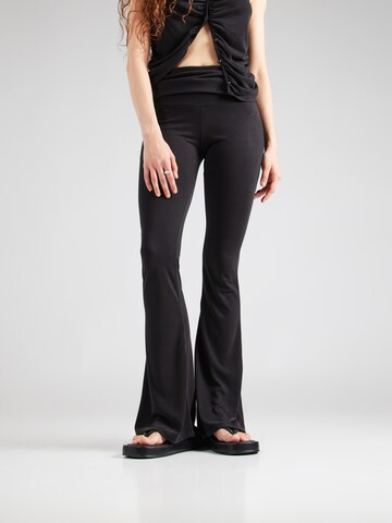 ABOUT YOU x Toni Garrn Flared Trousers in Black: front