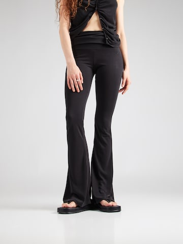 ABOUT YOU x Toni Garrn Flared Pants in Black: front