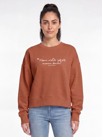Watapparel Sweatshirt 'Wenn Nicht Jetzt Wann Dann' in Bruin: voorkant