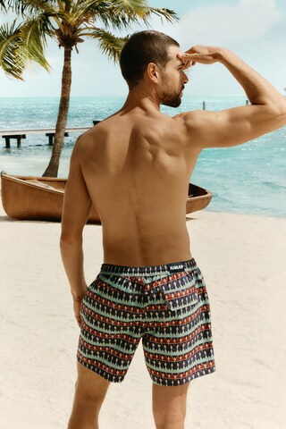 IUMAN Intimissimi Board Shorts in Red: front