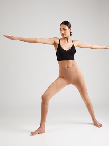 Athlecia Skinny Sportbroek 'Nagar' in Bruin