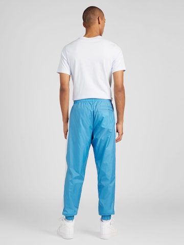Nike Sportswear Regular Juoksupuku värissä sininen