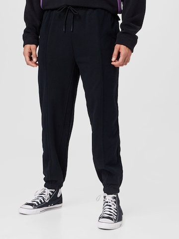 CONVERSE Tapered Pants in Black: front