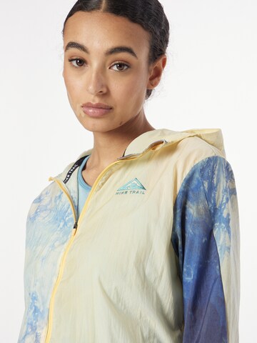 NIKE Sports jacket 'W NK TRAIL JACKET' in Yellow