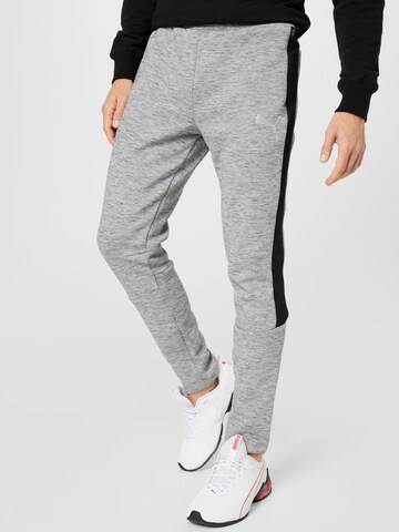 PUMA Slimfit Sportbroek in Grijs: voorkant