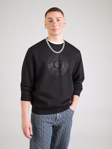 Bluză de molton de la GUESS pe negru: față