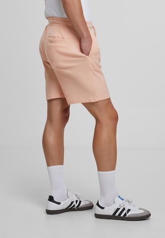 Urban Classics Loose fit Trousers in Orange