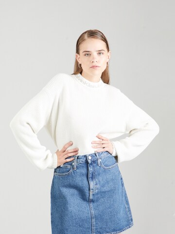 Pulover de la Calvin Klein Jeans pe bej: față