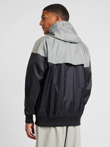 Nike SportswearPrijelazna jakna 'HERITAGE' - crna boja