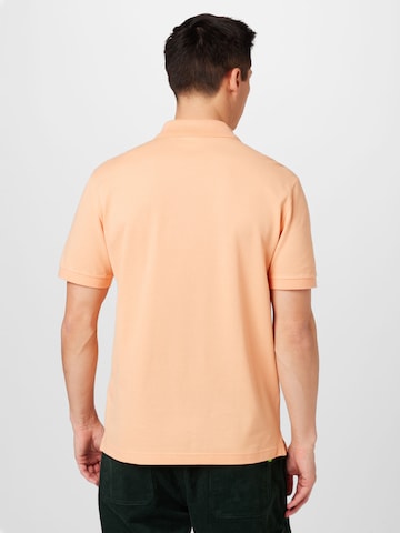 LACOSTE Přiléhavý střih Tričko – oranžová