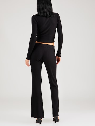 ABOUT YOU x Chiara Biasi Flared Trousers 'Delia' in Black