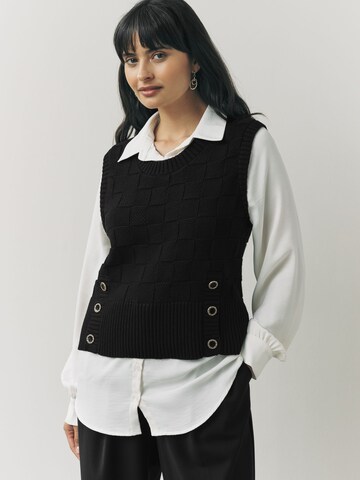 Next Blus i svart: framsida
