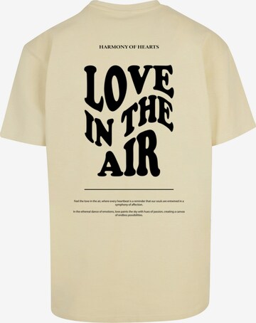 T-Shirt 'Love In The Air' Merchcode en jaune