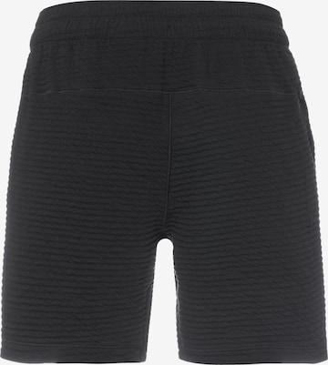 NIKE Regular Sports trousers in Black