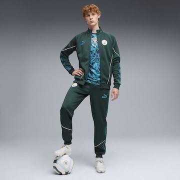 PUMA Tapered Sportbroek 'Manchester City KING Anthem' in Groen
