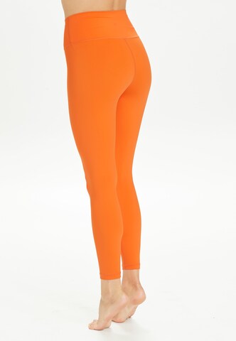 Athlecia Skinny Workout Pants 'GABY' in Orange