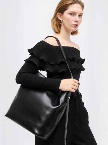 Top ' Flouncecras ' di Crās in nero: lato