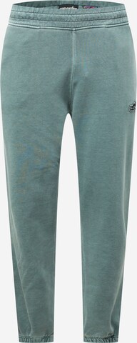 Superdry Tapered Trousers in Green: front