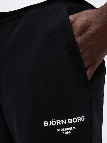BJÖRN BORG - Tapered Calças de desporto 'ESSENTIAL 1' em preto