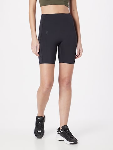 On Skinny Pants in Black: front