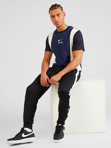Nike Sportswear Zwężany krój Spodnie 'AIR' w kolorze czarny