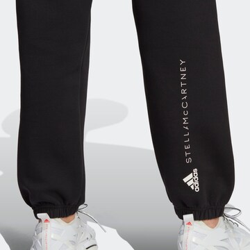 ADIDAS BY STELLA MCCARTNEY Tapered Urheiluhousut värissä musta