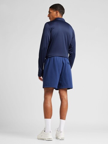 Nike Sportswear Loosefit Kalhoty 'CLUB' – modrá