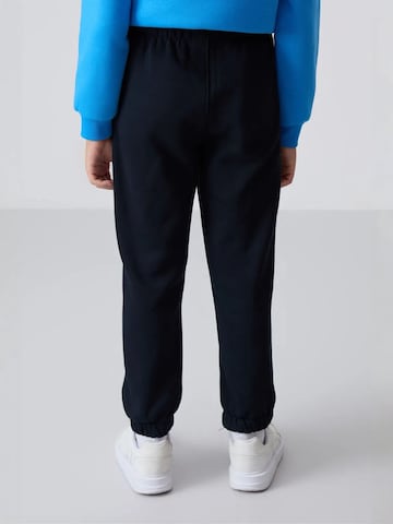 Tommy Life Broek 'TOMMY Kinder Jogginghose' in Zwart
