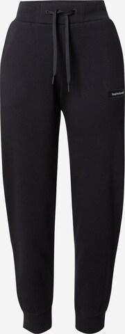 Tapered Pantaloni sportivi di PEAK PERFORMANCE in nero: frontale