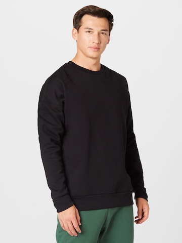 Kosta Williams x About You Sweatshirt in Black: front