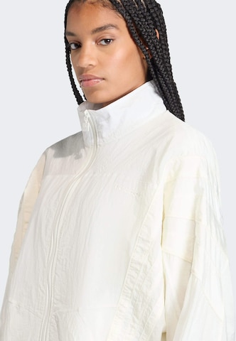 ADIDAS ORIGINALS Prehodna jakna 'Santiago' | bela barva