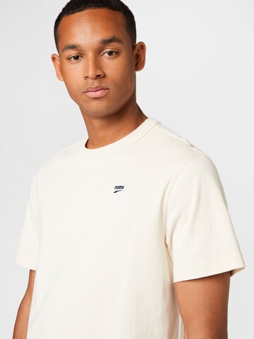 PUMA T-shirt 'Downtown' i beige