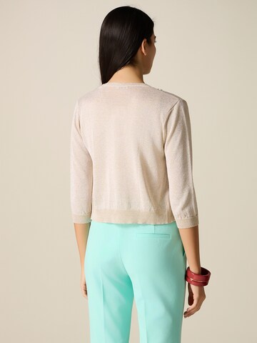 Cardigan oltre en or