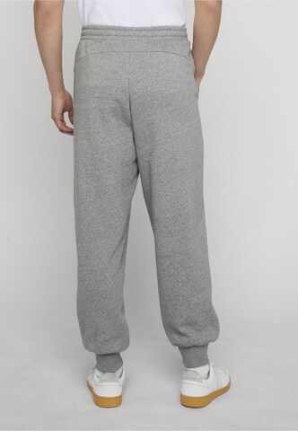 PUMA - Tapered Calças de desporto 'BMW MMS Essential+' em cinzento