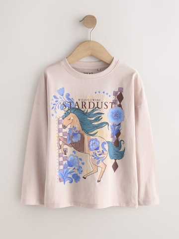 Tricou de la Next pe bej