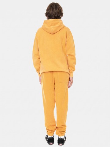 VANS Baggy Bukser 'Comfycuh Wash Sweatpant CMCS Orange' i orange