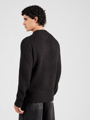 Pull-over Tommy Jeans en noir