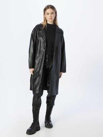 Karl Kani Between-Seasons Coat in Black: front