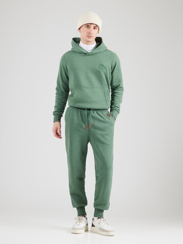 naketano Tapered Trousers 'Schnellbumser' in Green