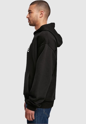 Merchcode Sweatshirt 'Naughty By Nature' in Black