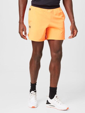 UNDER ARMOUR Regularen Športne hlače 'Peak' | oranžna barva: sprednja stran
