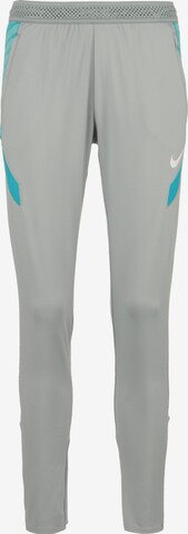 NIKE Slim fit Workout Pants in Grey: front