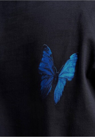 MT Upscale T-shirt 'Le Papillon' i blå