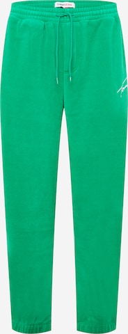 Tommy Jeans Spodnie w kolorze zielony: przód