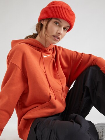 Nike SportswearSweater majica 'Phoenix Fleece' - narančasta boja