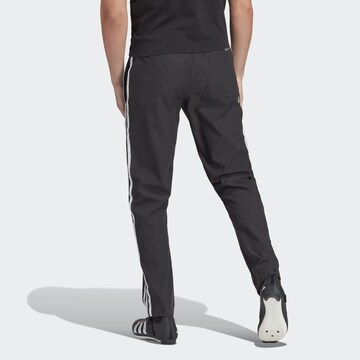 ADIDAS PERFORMANCE Regular Workout Pants 'The Trackstand' in Black