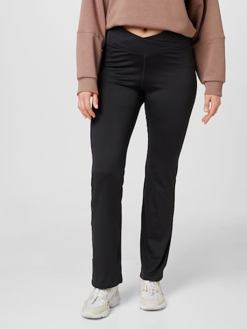 ReebokFlared/zvonoliki kroj Sportske hlače - crna boja: prednji dio